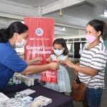 medical personnel giving out medicines