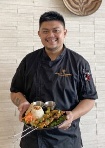 Chef holding a dish
